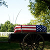 Shawn Ferry > The caisson, bearing the casket of Col. Clem Robert "Bob" Lawson USAF, passes in front of the Air Force Memorial, Arlington National Cemetery, July 8, 2009