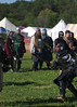 XXXV: Tuchux Charity Tournament : The Tuchux Charity Tournament is an event aimed as raising money to fight breast cancer. Fighters from all Kingdoms, as well as Tuchux warriors, come to donate money and compete for the title of champion. The fighting is done in four bear pits. Competitors draw lots from a helmet to see which weapon from the central pile they will be fighting with. The winner of each bought stays in the pit until defeated, gaining a hash mark for each victory. The top scorer from each pit then competes against each other until only one remains standing.